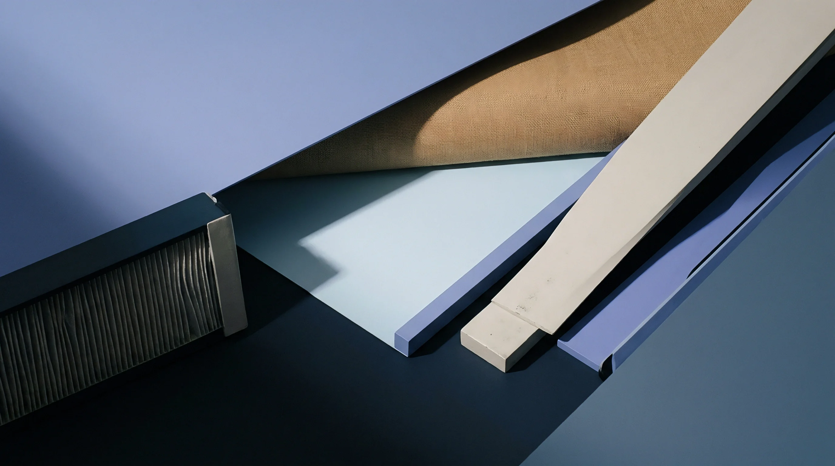 Various flat industrial panels in blue, purple, and beige tones are arranged in overlapping layers, with a dark textured component on the left.